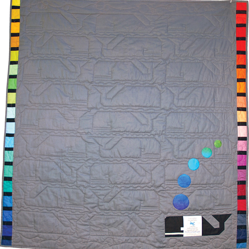 photo of the back of quilter cindy scraba’s the preppy whale quilt