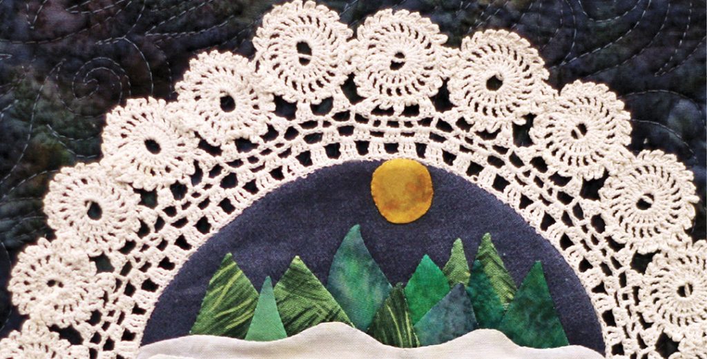  photo of appliqué in the centre of a lace doily