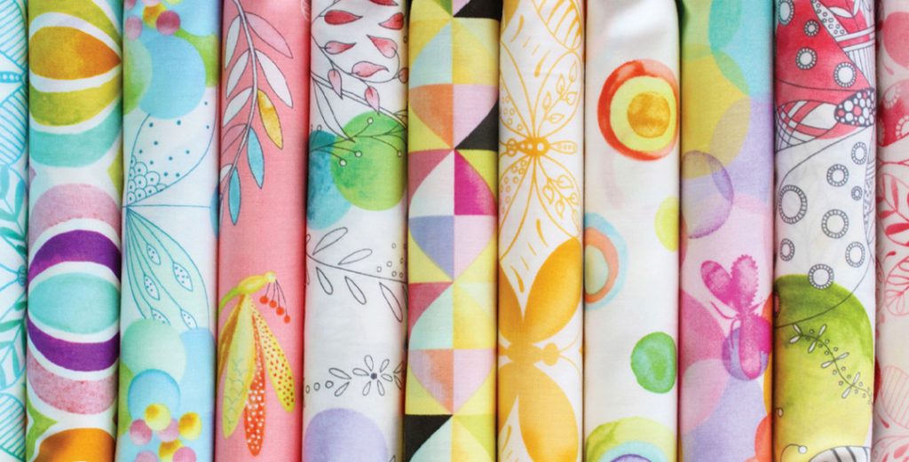 photo of bright modern quilting fabrics designed by tamara kate