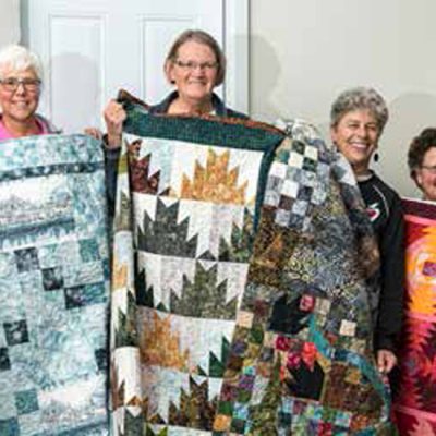 photo of the BGs with their Book Club Challenge quilts