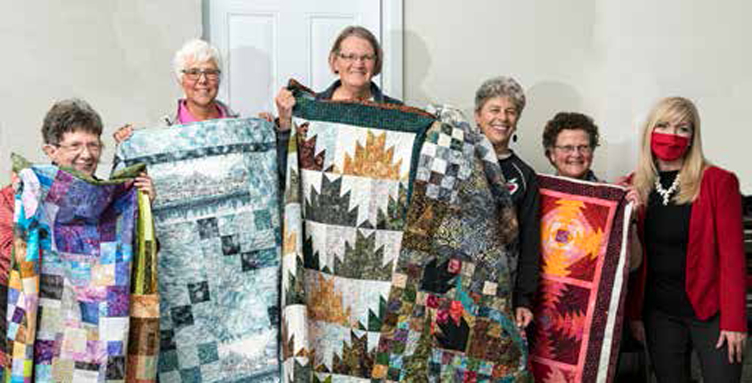photo of the BGs with their Book Club Challenge quilts